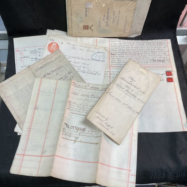 Vintage collection of mortgages and legal documents, antique paperwork.