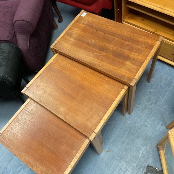 Vintage wooden nest of tables in graduated sizes.