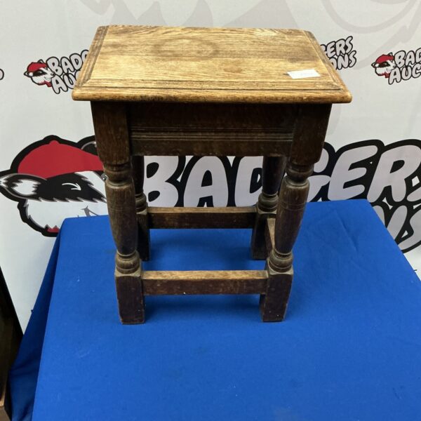 Small vintage oak table with aged patina.