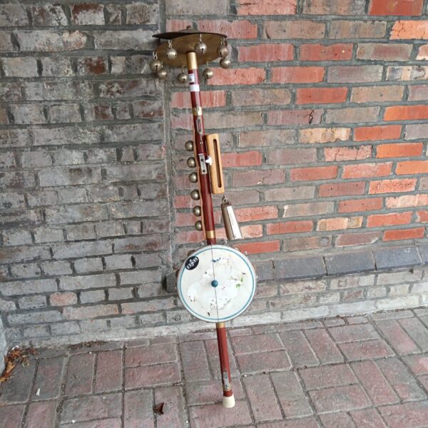 Vintage one man band instrument with drum and cymbals.
