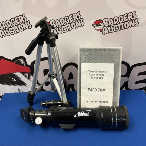 Vintage Orbinar F400 telescope with tripod for astronomical viewing.