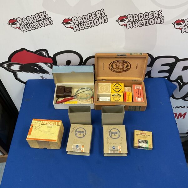 Lot of four vintage photography boxes for storage.