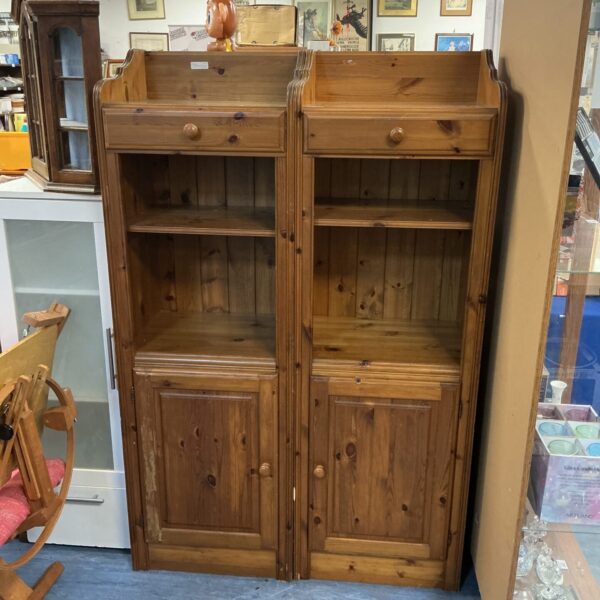 Pair of vintage pine storage cabinets with cupboard and drawer space.