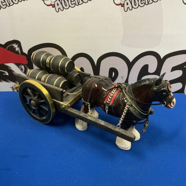 Detailed vintage porcelain shire horse and barrel cart figurine.