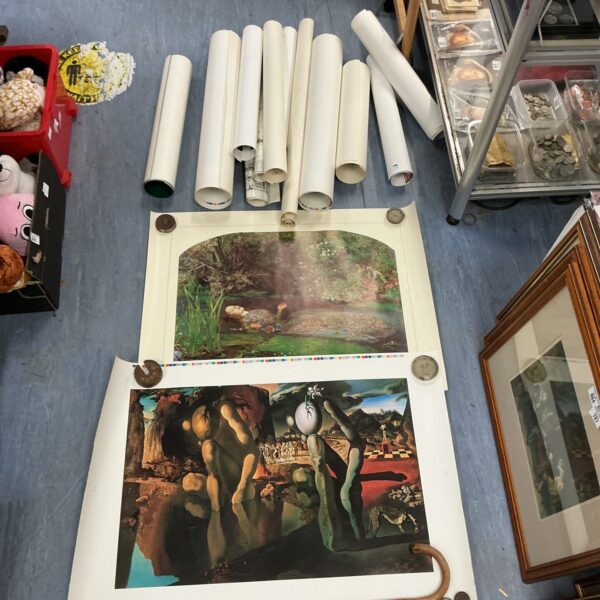 Rolled vintage posters, a collection of decorative prints for wall art.