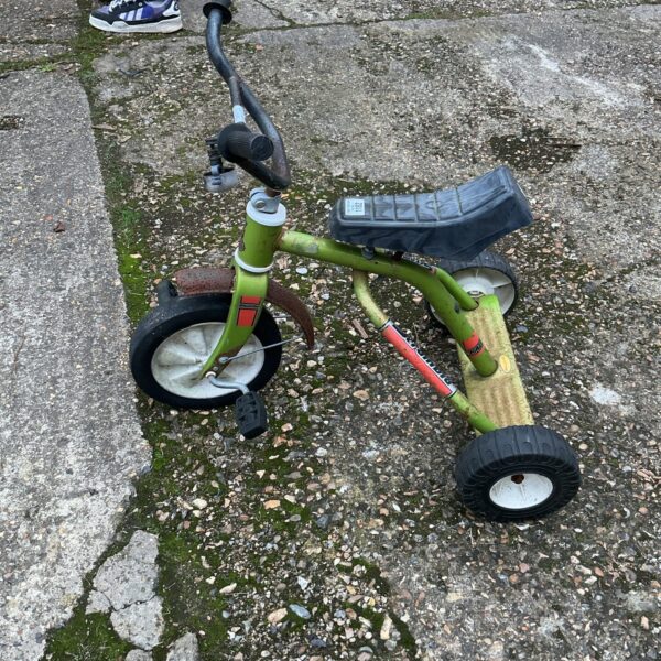 Green vintage Scramble trike, a classic child’s ride-on toy.