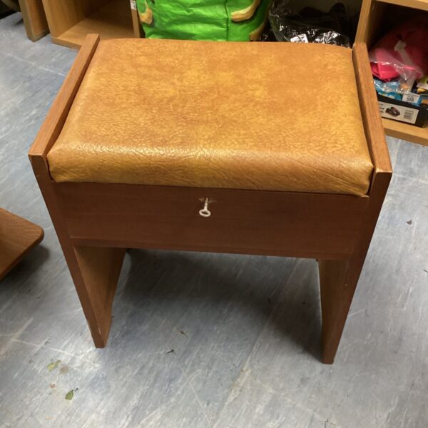 Vintage leather topped sewing stool with key.