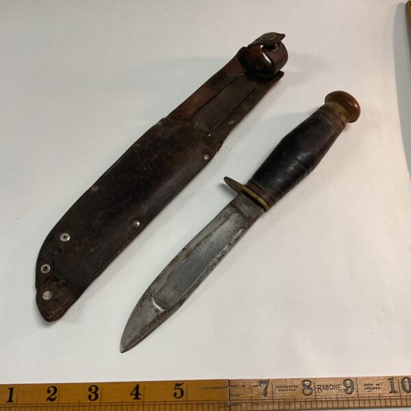 Vintage Sheffield knife with stacked leather handle and sheath.