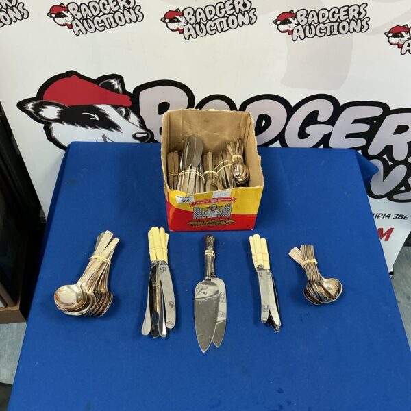 Large quantity of vintage silverware including knives, forks, and spoons.