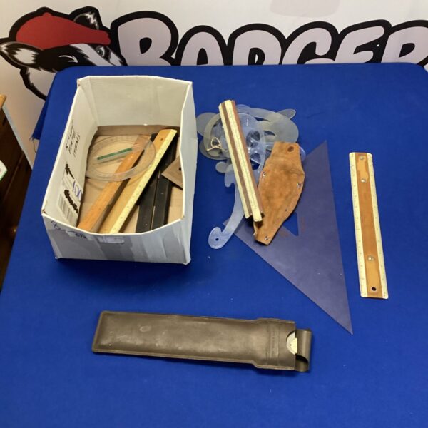 Lot of vintage slide rules with micrometer for calculating and measuring.