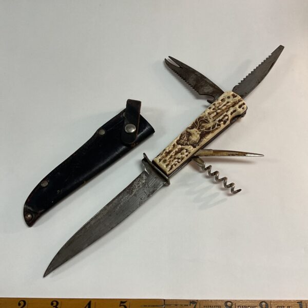 Vintage Solingen folding knife with stag horn handle and leather sheath.