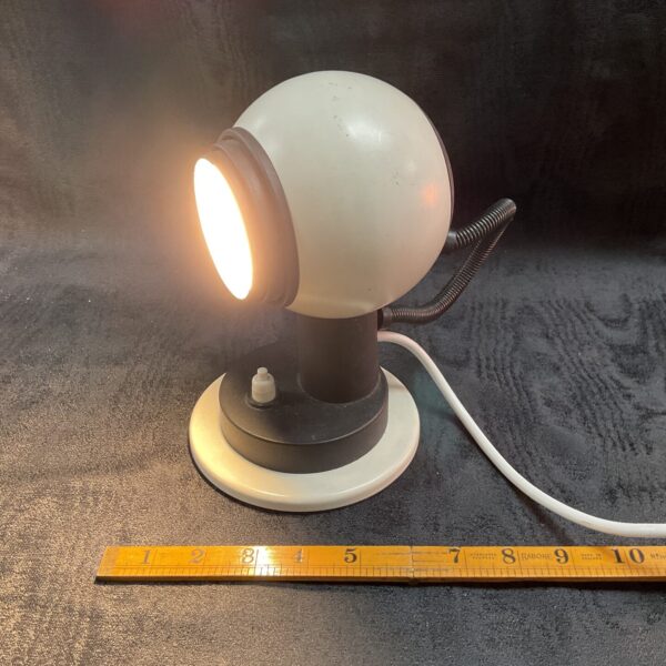 Vintage First Light Products table lamp with spherical shade.