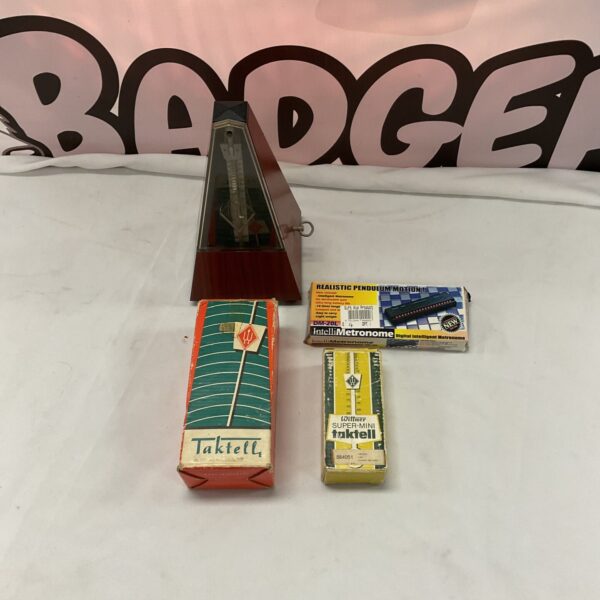 Vintage Taktell metronome with pendulum, a classic musical tool.