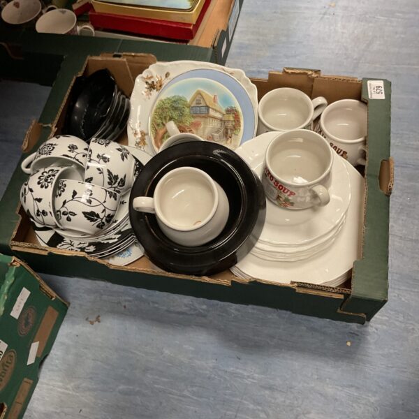 Vintage floral tea set with cups, saucers, and plates.