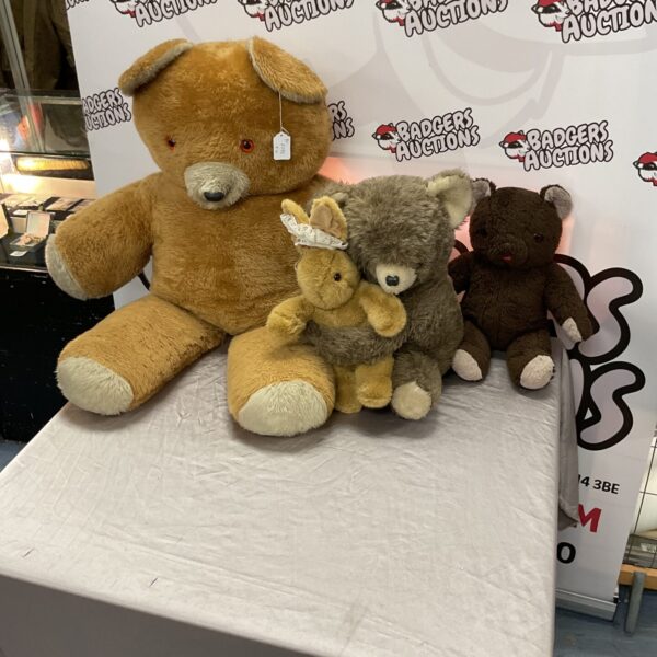 A lot of vintage teddy bears on a display background.