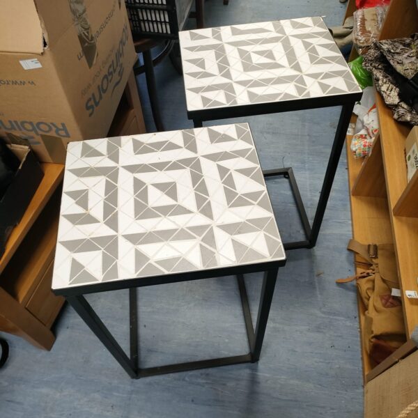 Pair of vintage tiled pot stands with geometric mosaic design.