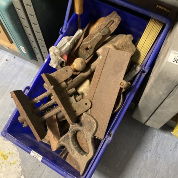 Vintage tool lot with metal clamps and implements.