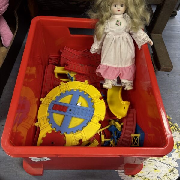 Vintage train track and porcelain doll lot for collectors.