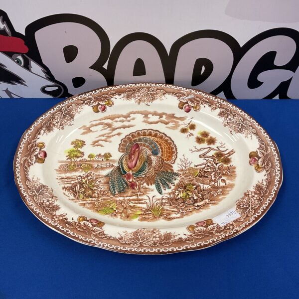 Vintage oval turkey platter with detailed transferware design.