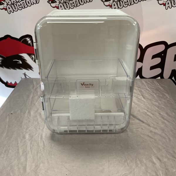Clear vintage plastic vanity box for cosmetics and jewellery.