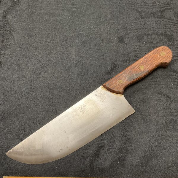 Vintage Victorinox butcher knife with wooden handle and steel blade.