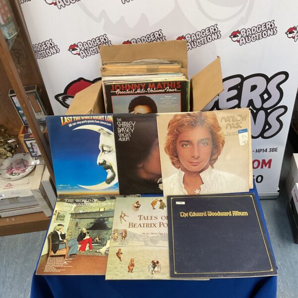 Vintage vinyl record lot featuring Shirley Bassey and Barry Manilow.