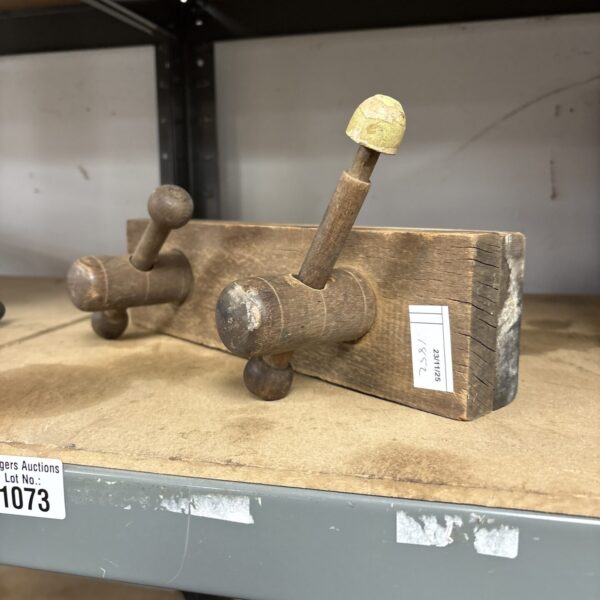 Vintage wood clamp with wooden jaw and screw mechanism.