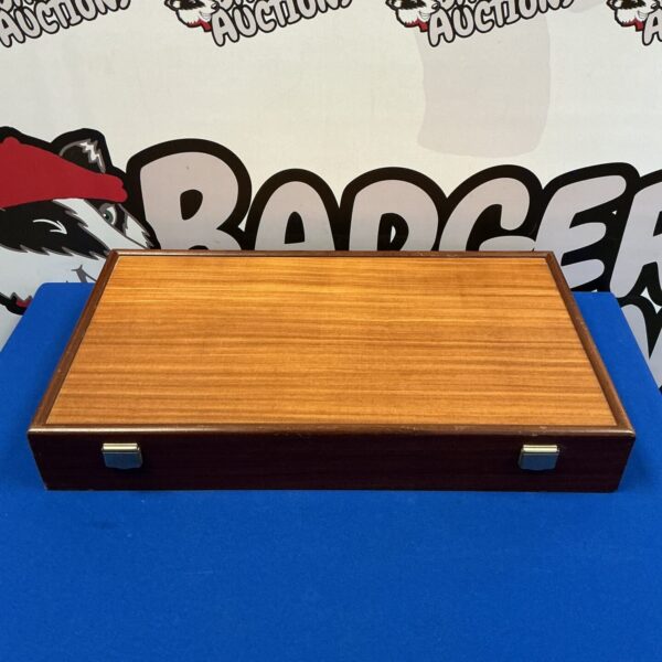 Open vintage wooden box with a warm wood interior.