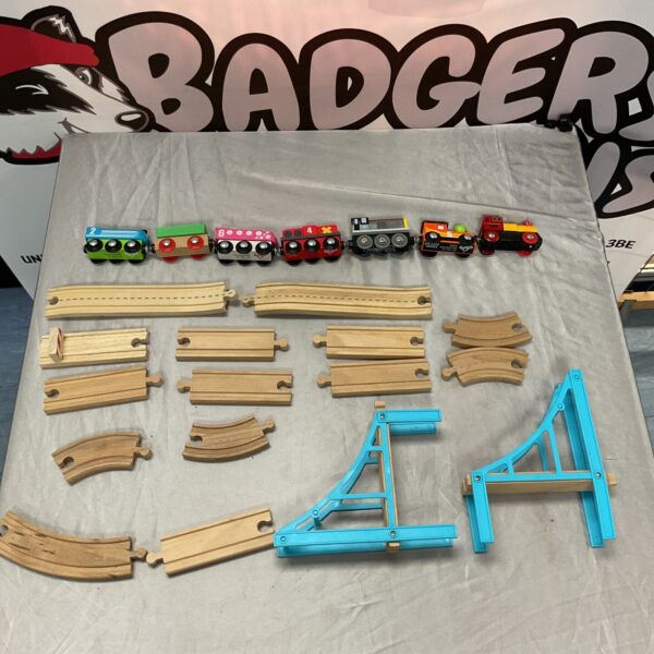 Vintage wooden carousel train set with track and accessories.