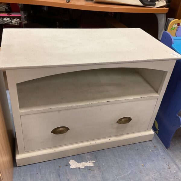 Front view of a vintage wooden dresser with drawers.