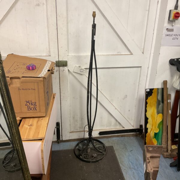 Vintage wrought iron standard lamp with adjustable height.