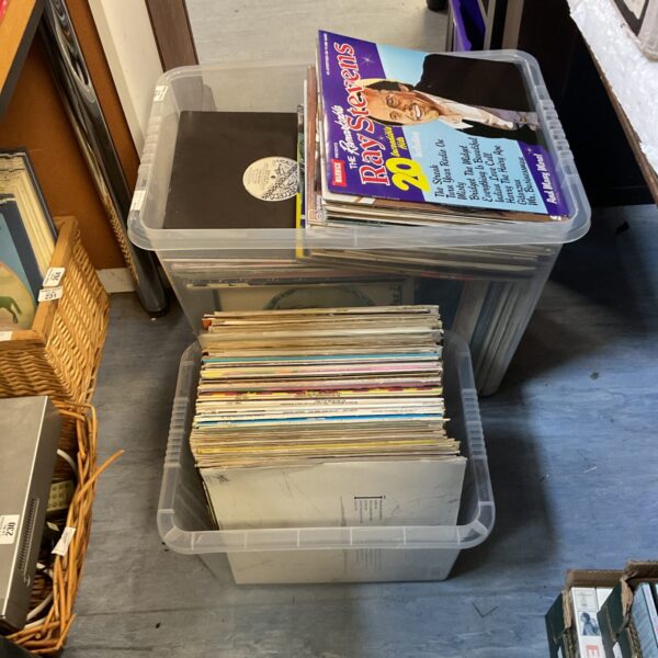 Large lot of vintage vinyl records in storage boxes.