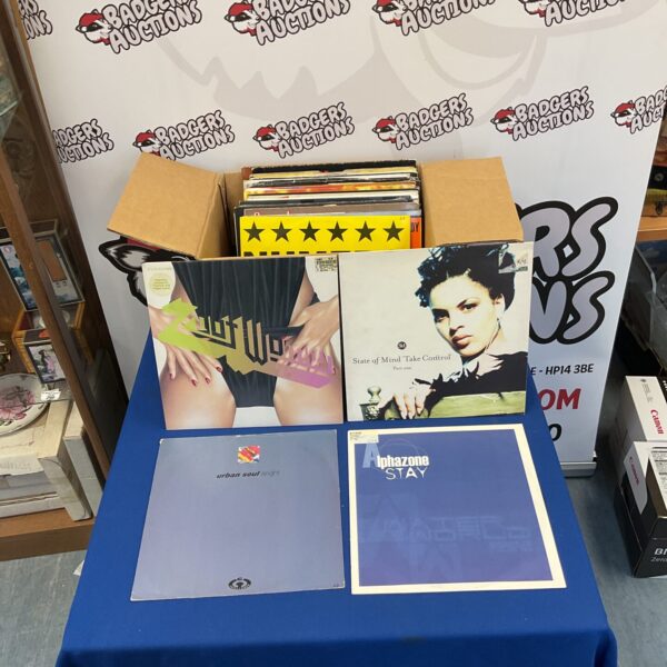 Diverse vinyl record collection with LP records and 12 inch singles.