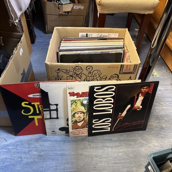 Mixed vinyl record lot with Jason Donovan albums visible.