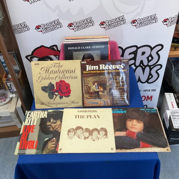 Vintage vinyl record lot featuring artists like Jim Reeves.