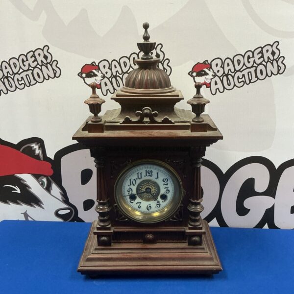 Antique W Watts Greenwich mantle clock with brass detailing.