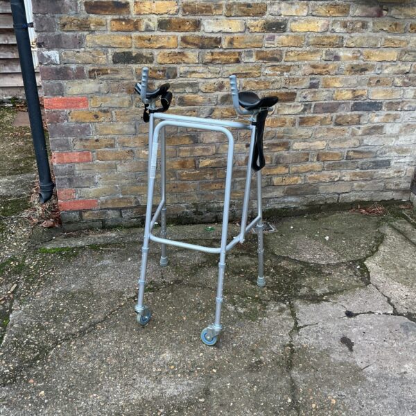 Adjustable height walking frame for mobility assistance.