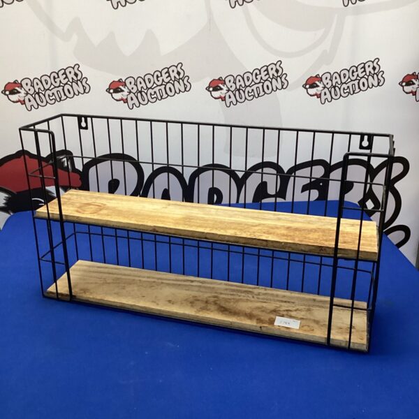 Rustic wall spice rack with wooden shelves for kitchen storage.