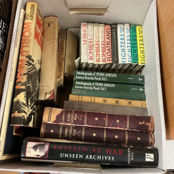 Vintage war history books collection, aviation and military themes.