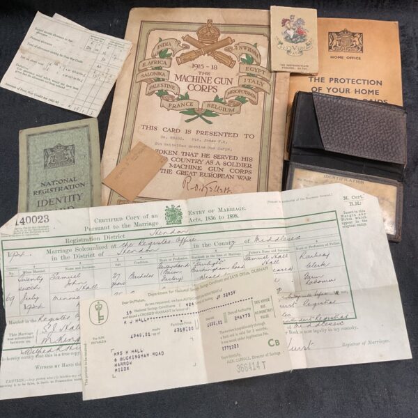 Vintage wartime ephemera collection featuring military documents and forms.