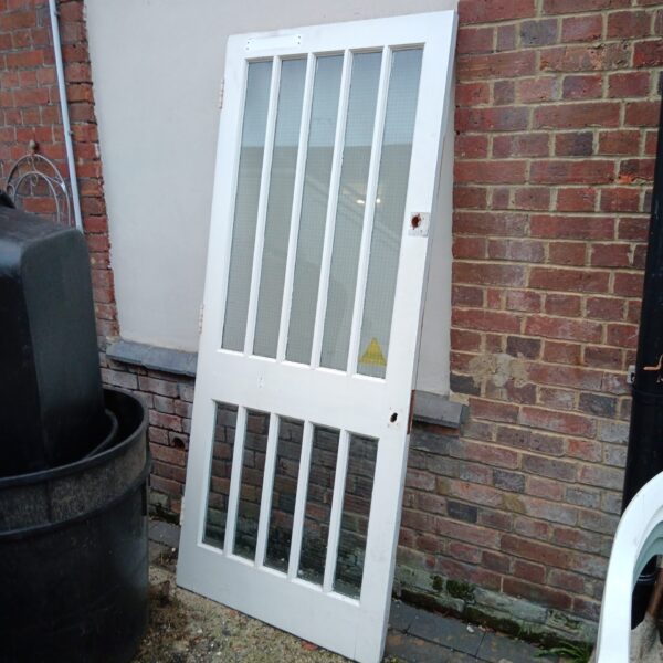 Vintage white glass panel door for interior use.