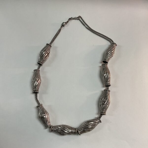 Vintage white metal tubular necklace, 28 inches long.