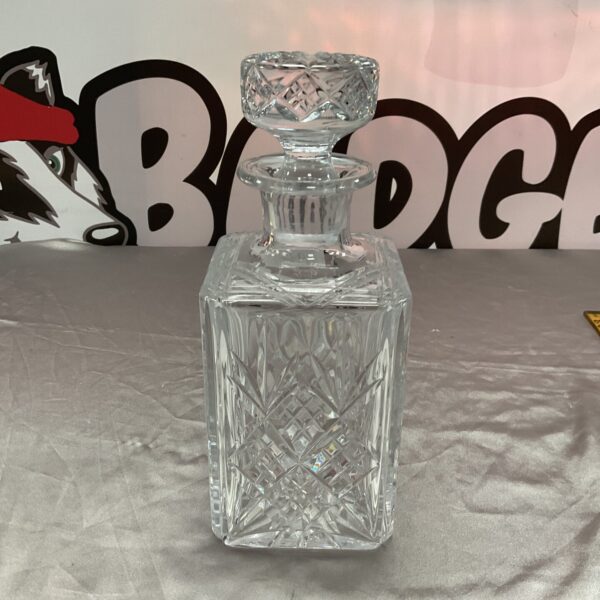 Whitefriars crystal decanter with detailed cut glass design.