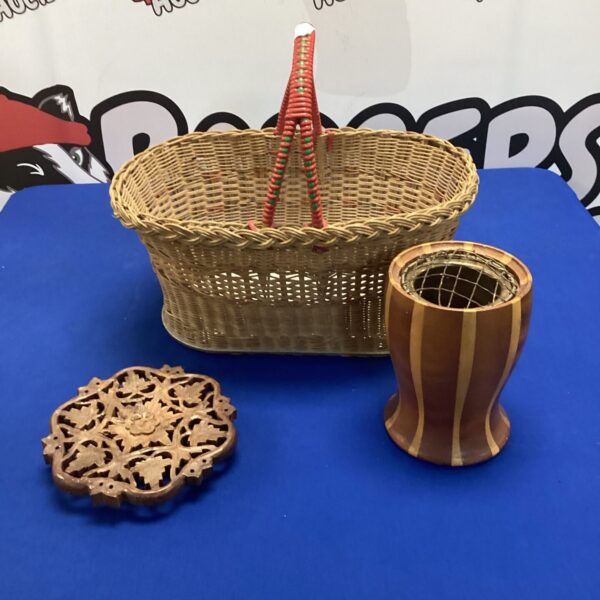 Vintage wicker basket with wooden trivet and posey vase.