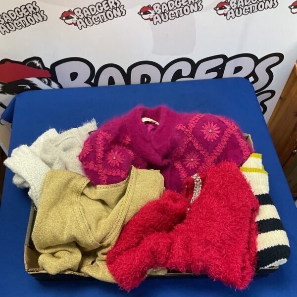 Women's clothing lot featuring soft knitwear and striped socks.