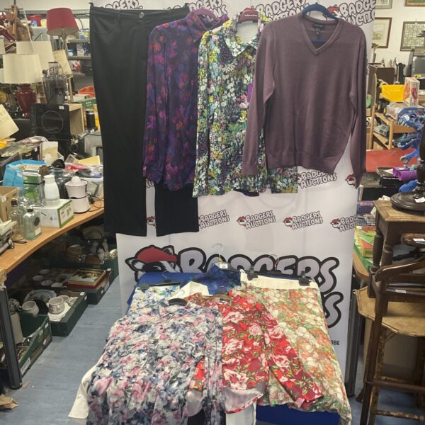 Women’s clothing lot size 14 with patterned dresses and tops.