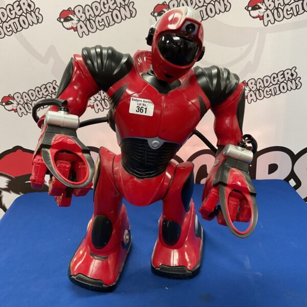 Red Wowwee Robosapien v2 robot, a collectible remote control toy.