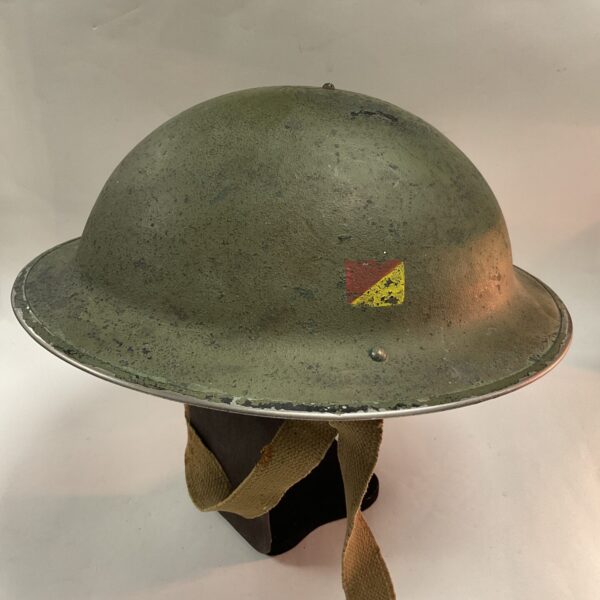Vintage WWII British Brodie helmet with Royal Signals flash.
