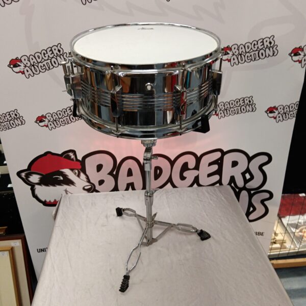 Vintage X drum snare drum with stand, percussion instrument.