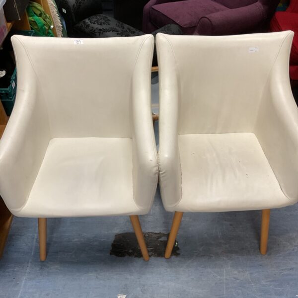 Pair of vintage Yorkville style dining chairs with wooden legs.